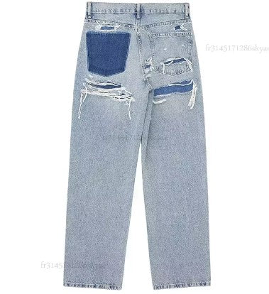 Jeans met Scheuren en Decoratieve Details